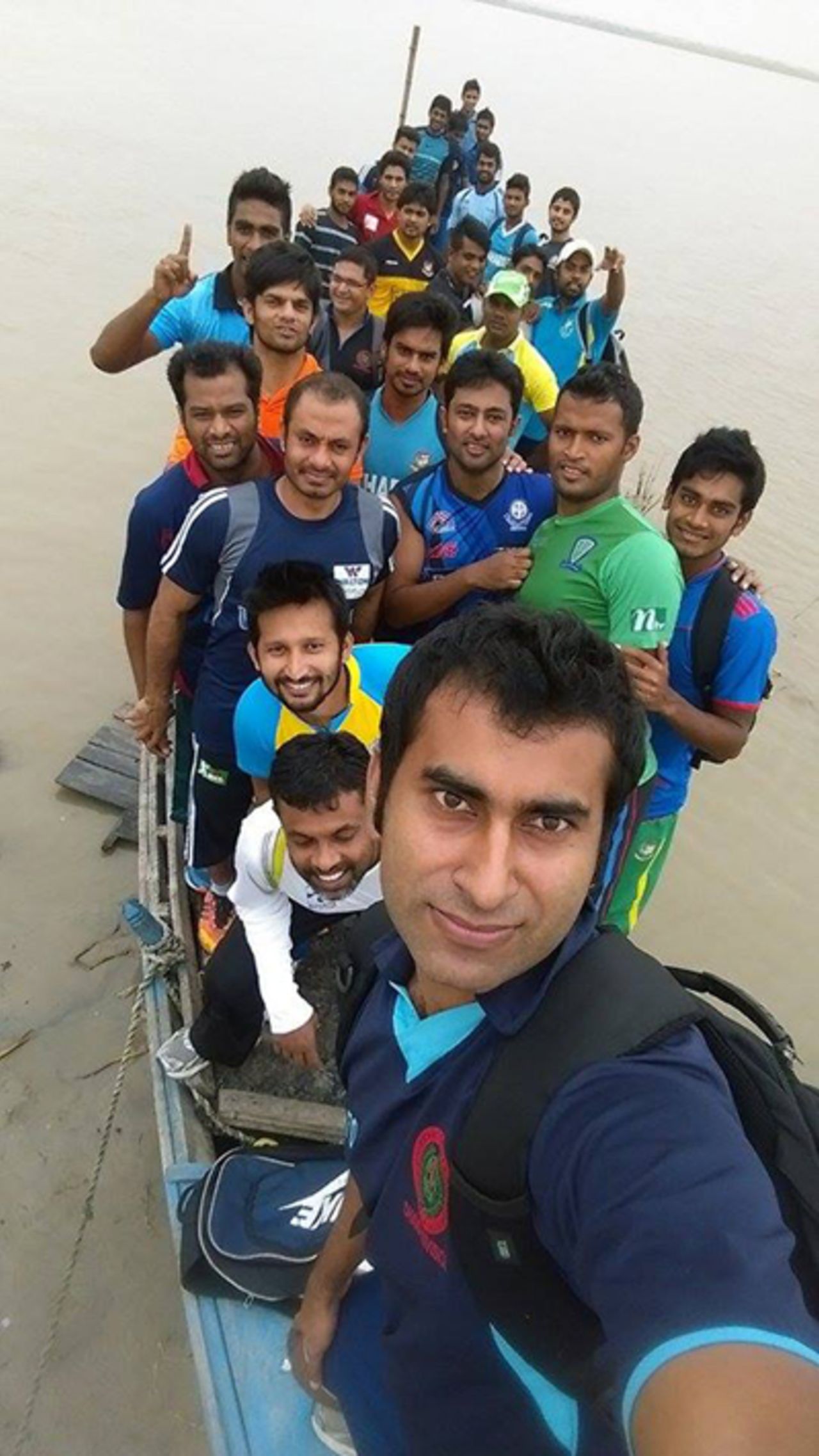 Mosharraf Hossain takes a selfie on a boat on the Padma River in Rajshahi, with players of Gazi Tank and Kalabagan Cricket Academy, September 26, 2014