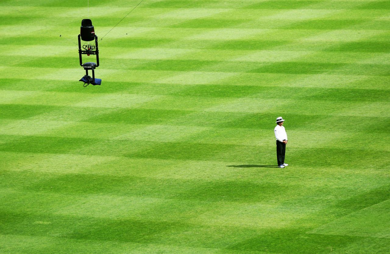 Umpire Asad Rauf stands with th Spidercam hovering above, Australia v South Africa, first Test, day four, Brisbane, November 12, 2012
