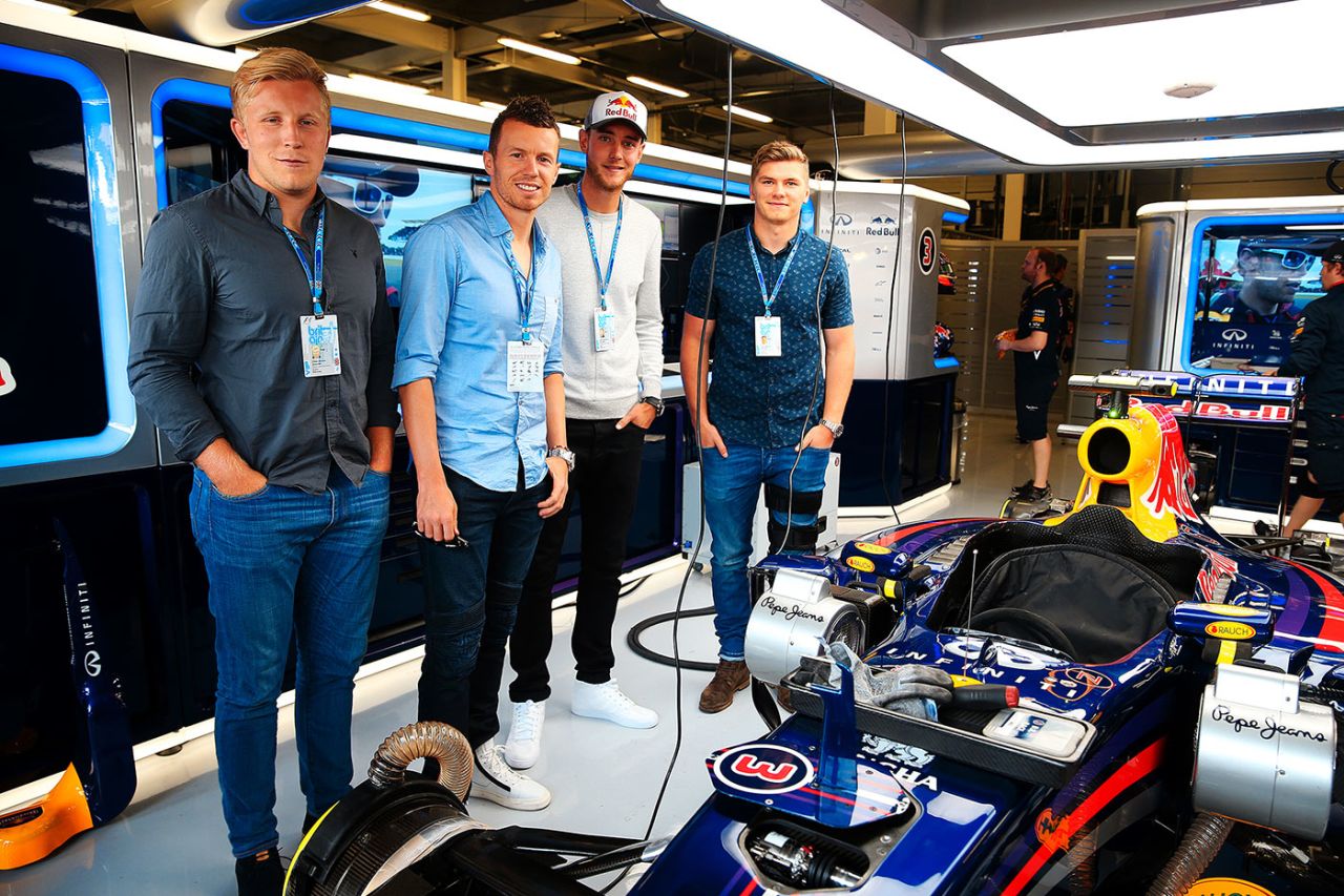 Peter Siddle, Stuart Broad and rugby player Owen Farrell at the Red Bull garage in Silverstone, Northampton, July 6, 2014