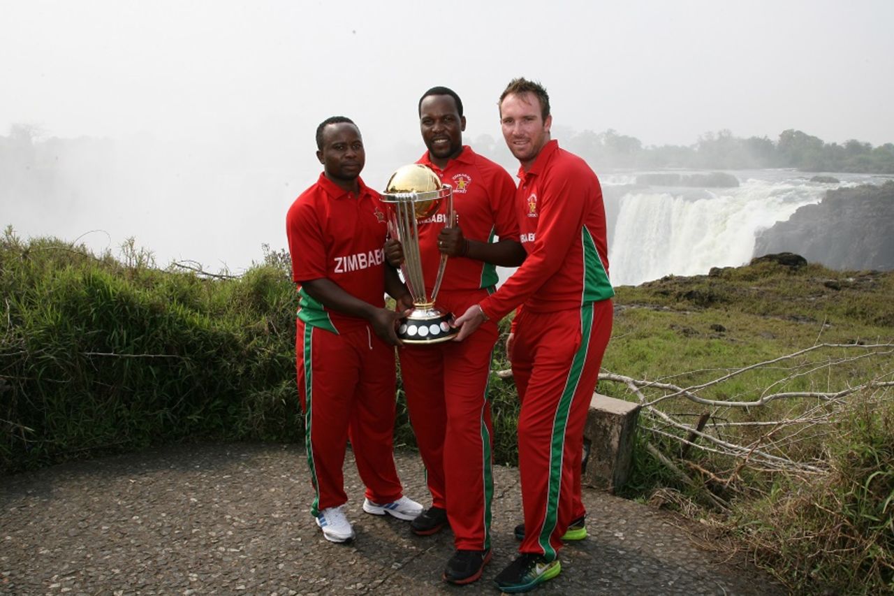 Prosper Utseya, Hamilton Masakadza and Brendan Taylor with the World Cup trophy at Victoria falls, September 30, 2014