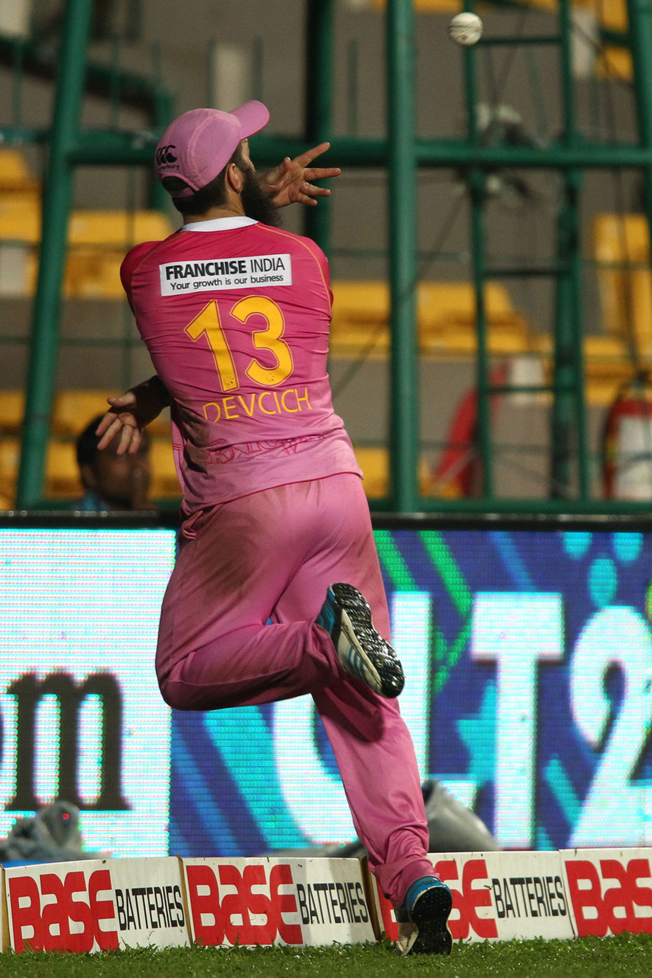 Anton Devcich throws the ball back to Daryl Mitchell in a relay catch, Barbados Tridents v Northern Districts, Champions League T20, Group B, Bangalore, September 30, 2014