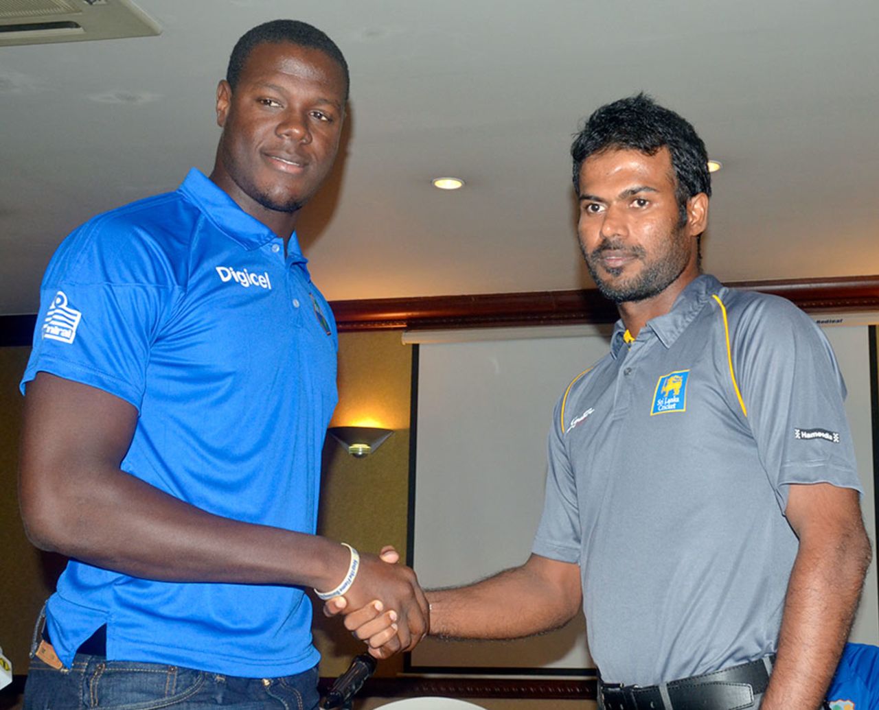 Carlos Brathwaite and Upul Tharanga shake hands at the start of the West Indies A tour of Sri Lanka, Colombo, October 8, 2014