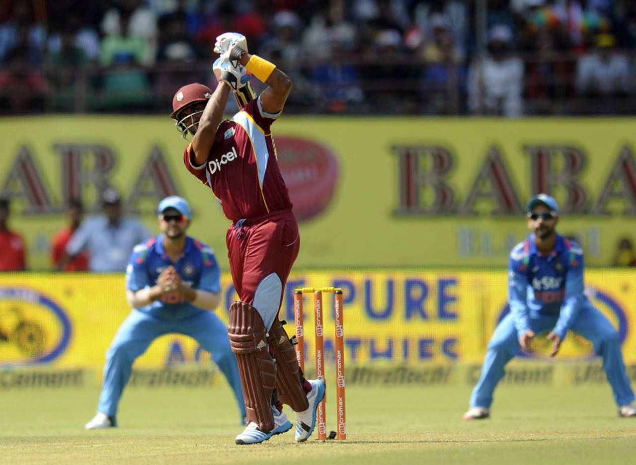 Dwayne Bravo clobbers the ball down the ground, India v West Indies, 1st ODI, Kochi, October 8, 2014