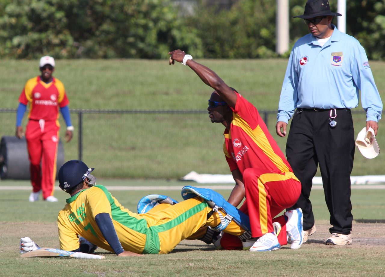 Ravi Timbawala gets assistance from Barrington Bartley after suffering knee injury, New York v South West, USACA T20 National Championship, Lauderhill, August 16, 2014