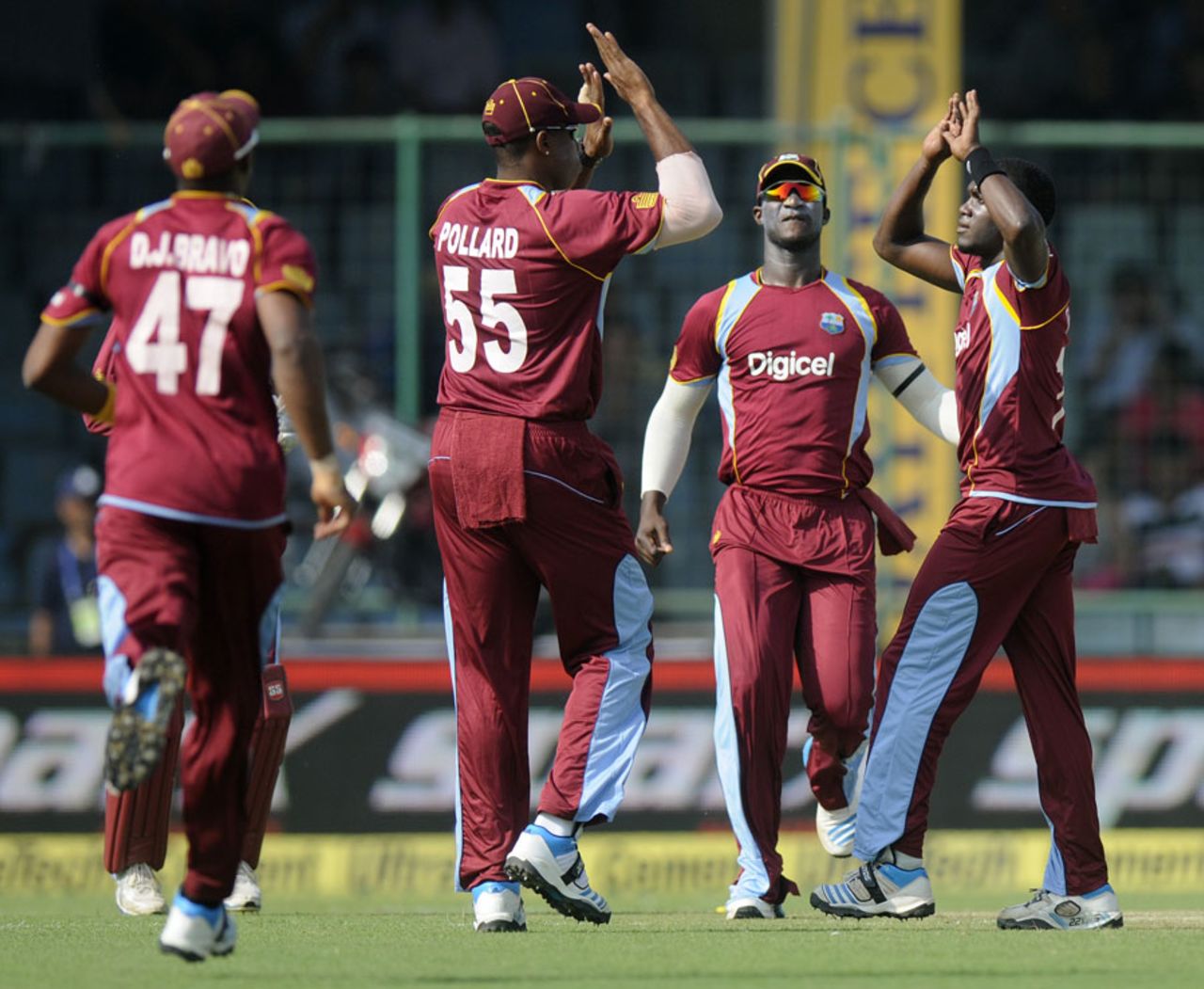 Jerome Taylor is congratulated after bowling Shikhar Dhawan, India v West Indies, 2nd ODI, Delhi, October 11, 2014