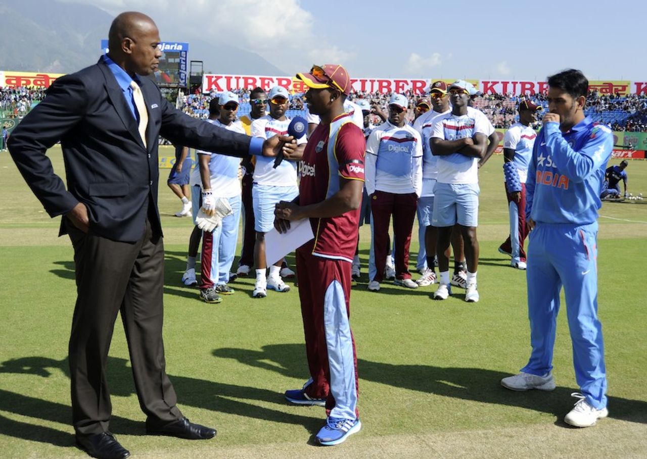 The West Indian team stood behind Dwayne Bravo at the toss, India v West Indies, 4th ODI, Dharamsala, October 17, 2014