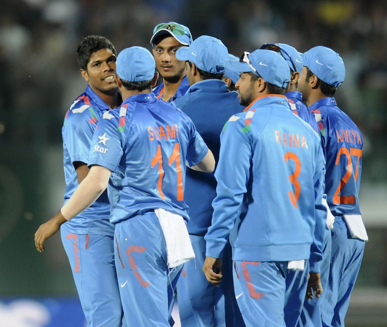 Umesh Yadav is mobbed by his teammates after the wicket of Dwayne Smith, India v West Indies, 4th ODI, Dharamsala, October 17, 2014