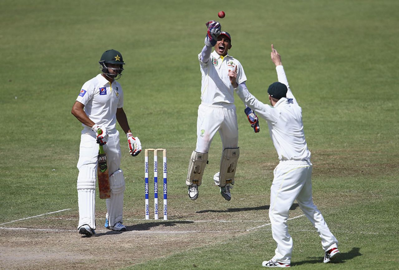 Australia's stand-in wicketkeeper Saqlain Haider celebrates a catch, Pakistan A v Australians, tour match, Sharjah, 3rd day, October 17, 2014