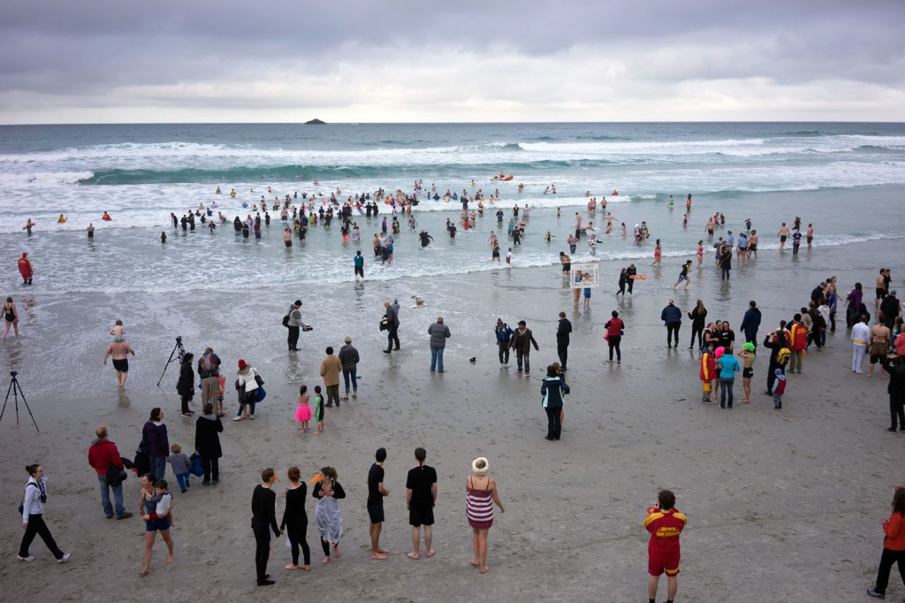 Participants in the 2014 Dunedin Polar Plunge run towards the sea at St Clair beach, Dunedin, June 14, 2014