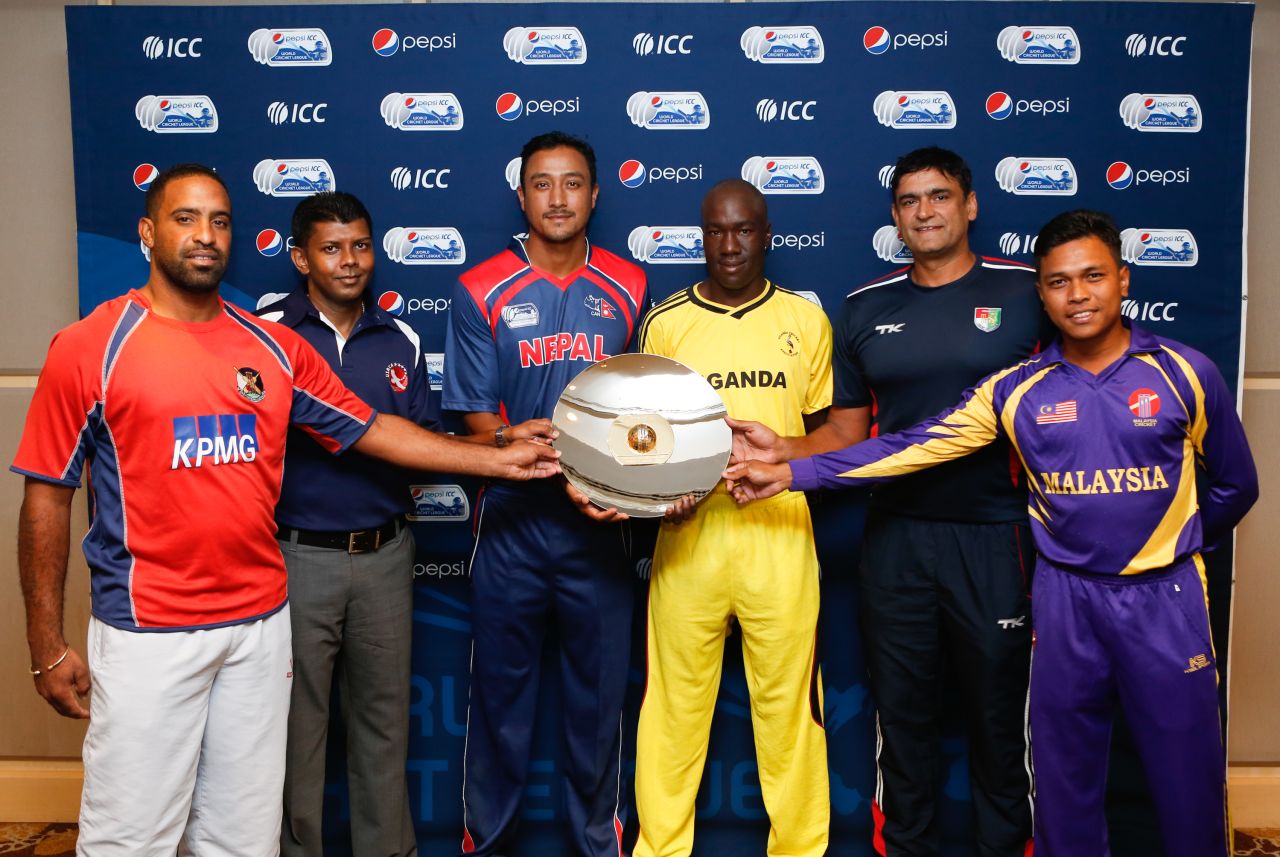 The six captains pose with the WCL Division Three trophy, World Cricket League Division 3, Kuala Lumpur, October 22, 2014