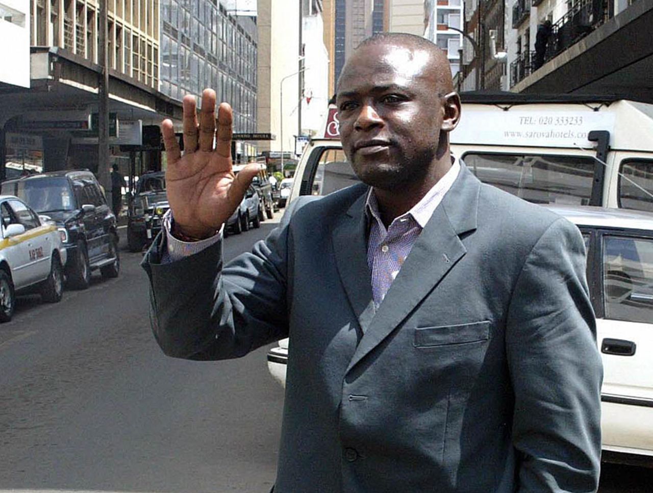 Maurice Odumbe arrives for his hearing at a Nairobi hotel, May 19, 2004