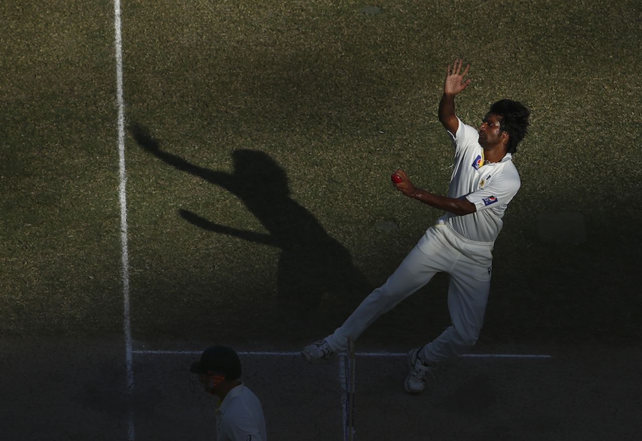 Rahat Ali comes out of the shadows to bowl, Pakistan v Australia, 1st Test, Dubai, 2nd day, October 23, 2014