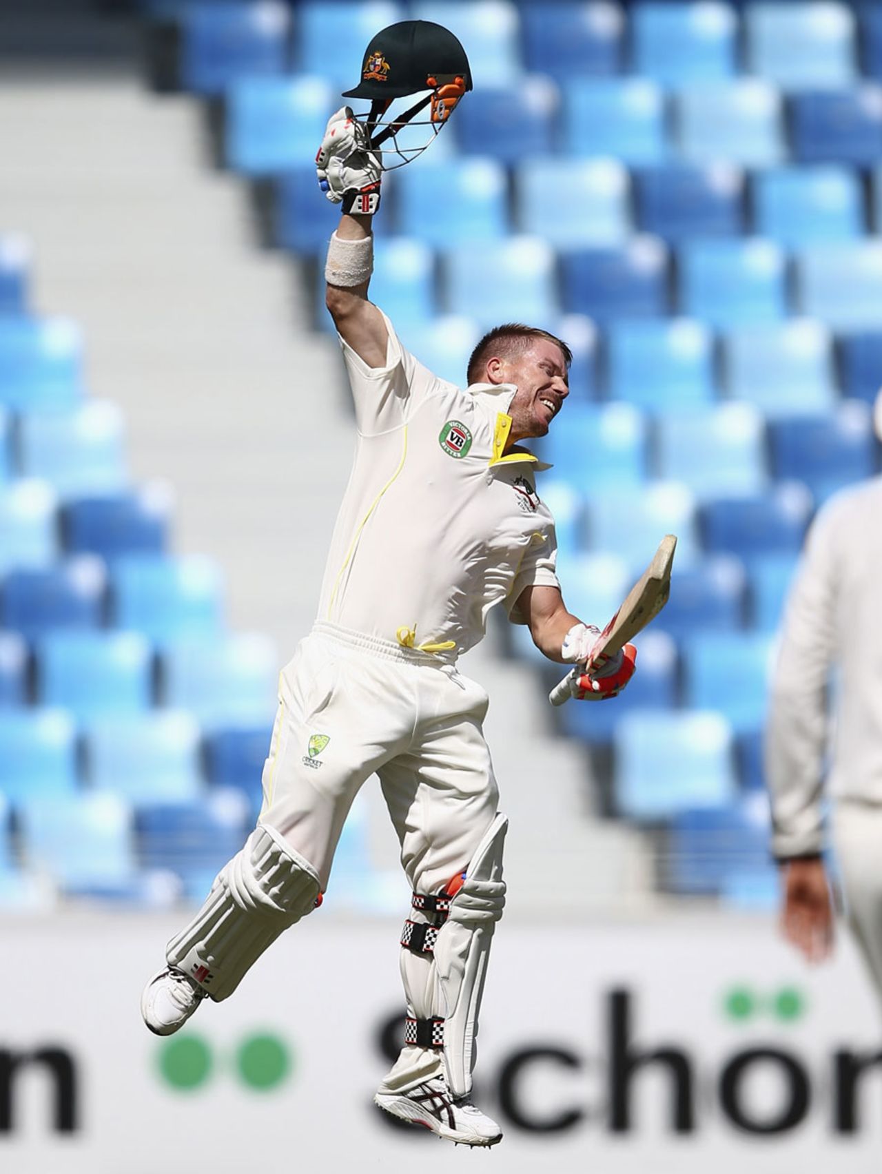 David Warner leaps in joy after reaching his century, Pakistan v Australia, 1st Test, Dubai, 3rd day, October 24, 2014