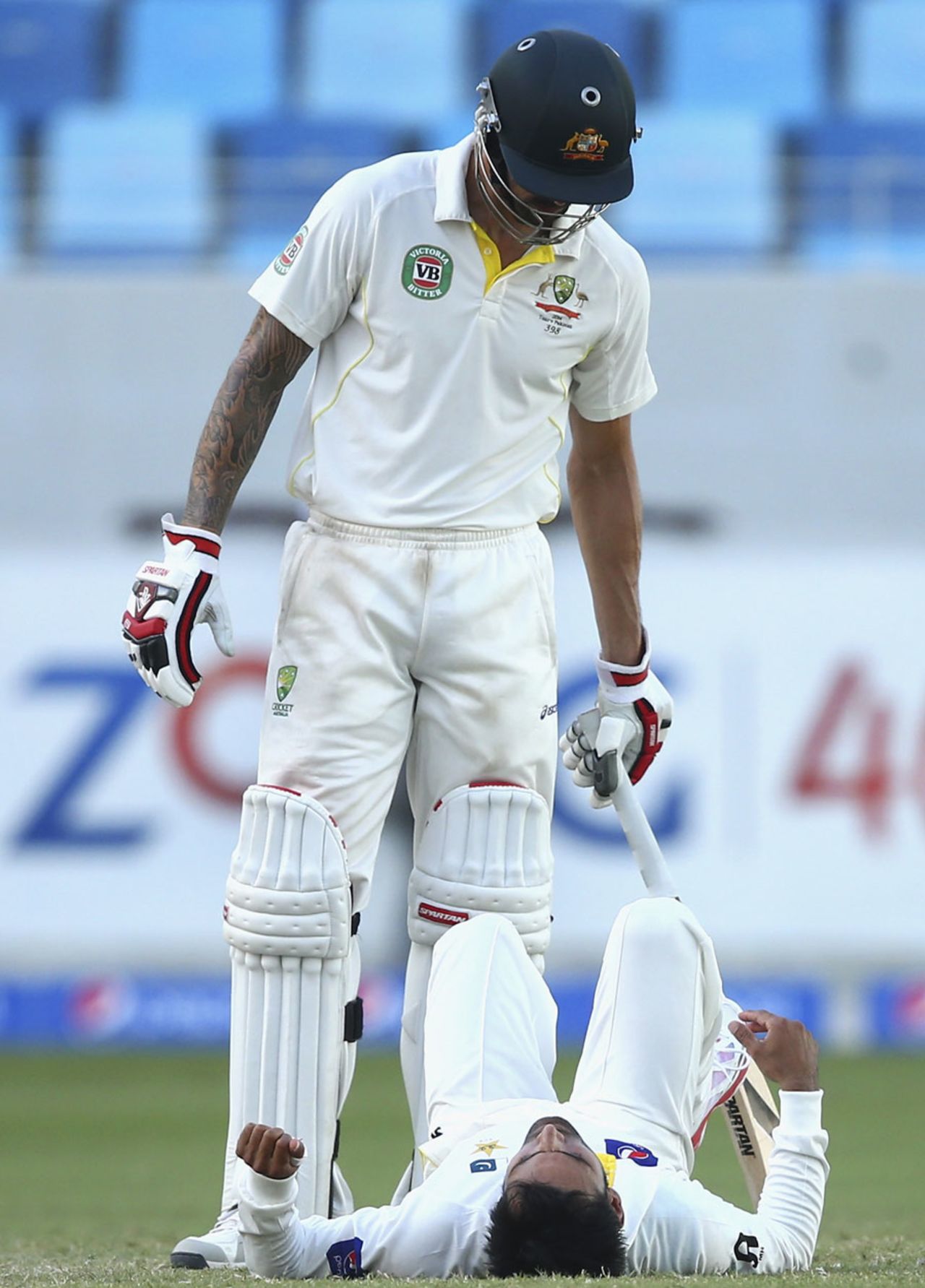 Mitchell Johnson checks if Mohammad Hafeez is alright, Pakistan v Australia, 1st Test, Dubai, 3rd day, October 24, 2014