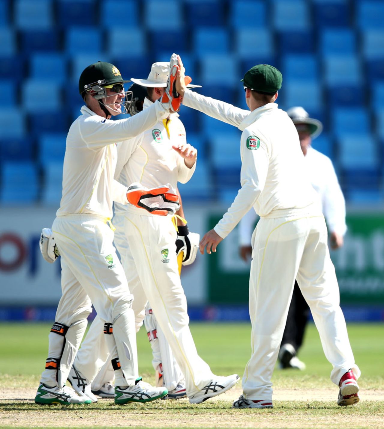 The Australian players celebrate Azhar Ali's wicket, Pakistan v Australia, 1st Test, Dubai, 4th day, October 25, 2014