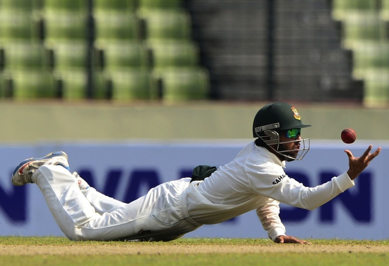 Mominul Haque dives to try and catch a ball, Bangladesh v Zimbabwe, 1st Test, Mirpur, 1st day, October 25, 2014