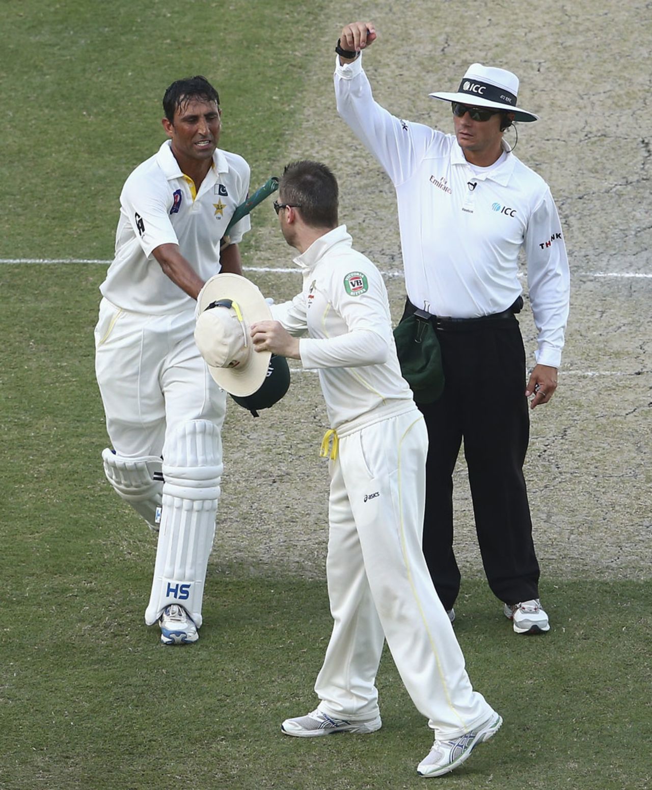 Younis Khan is congratulated by Michael Clarke after recording his second hundred of the Test, Pakistan v Australia, 1st Test, Dubai, 4th day, October 25, 2014