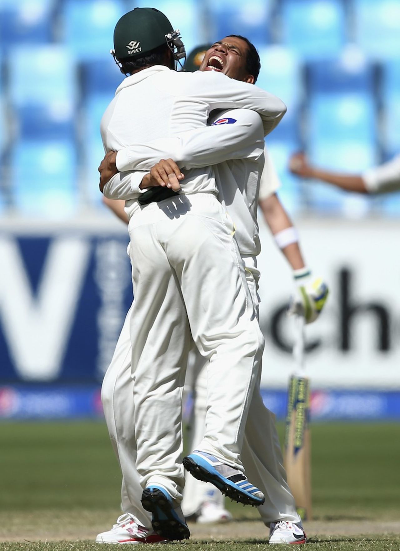 Zulfiqar Babar and Azhar Ali celebrate a wicket, Pakistan v Australia, 1st Test, Dubai, 5th day, October 26, 2014