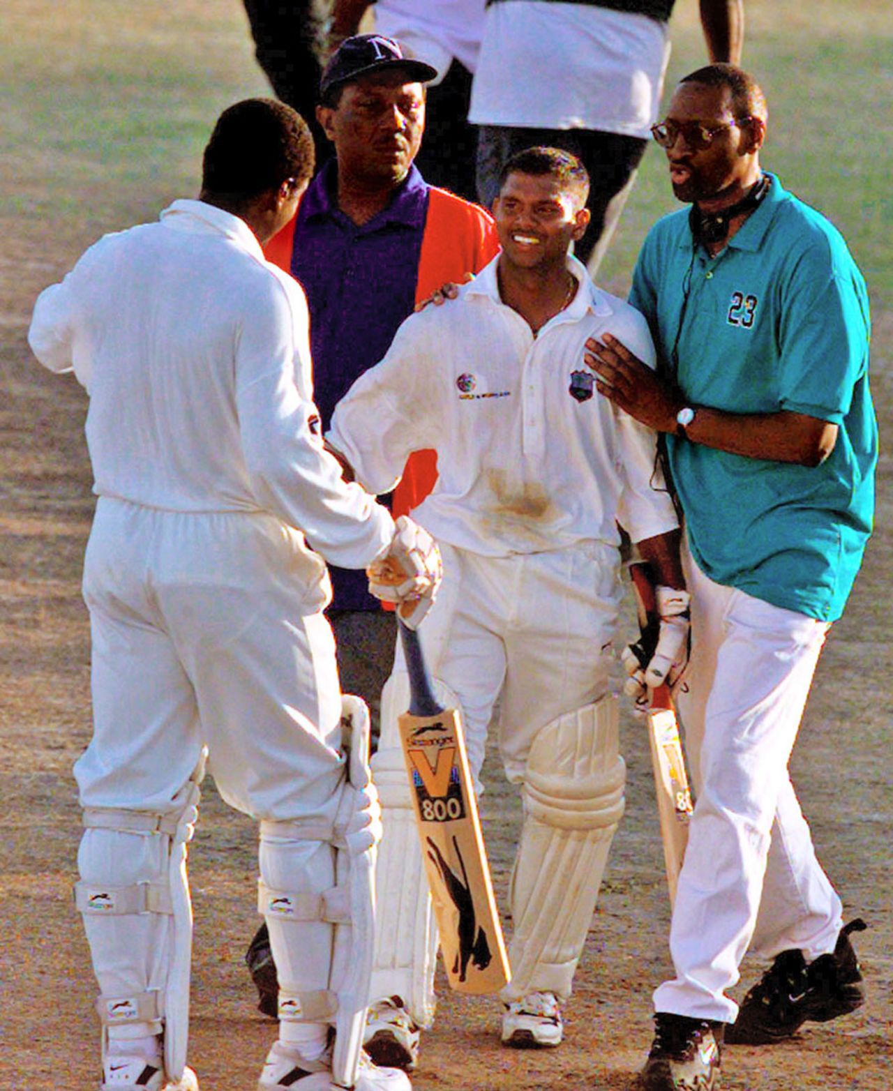 Shivnarine Chanderpaul is greeted by Carl Hooper after scoring a century, West Indies v England, 4th Test, 1st day, February 27, 1998