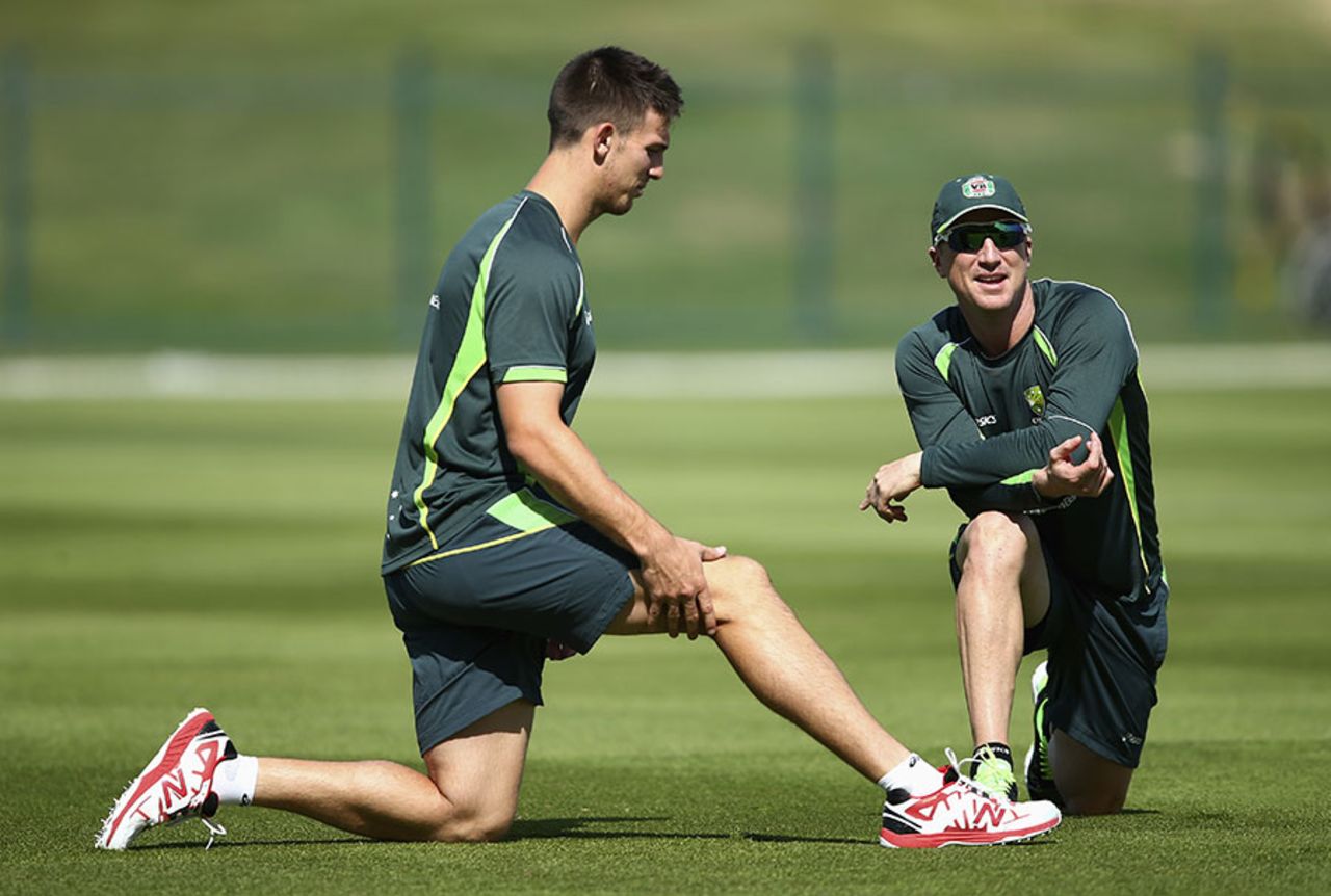 Mitchell Marsh and Brad Haddin stretch during Australia's training session, Abu Dhabi, October 28, 2014
