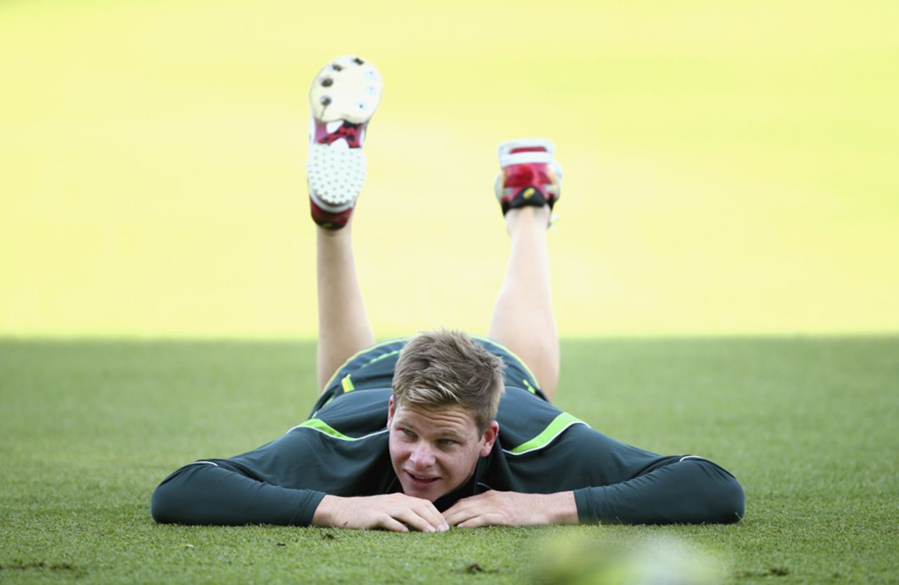 Steven Smith stretches during a training session, Abu Dhabi, October 29, 2014