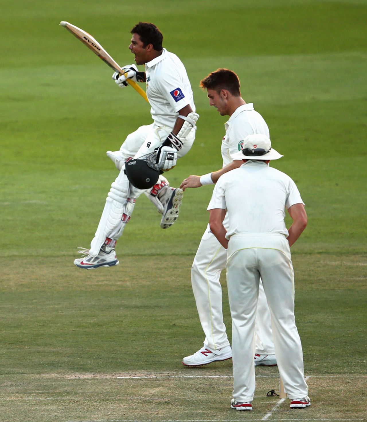 Azhar Ali leaps with joy after reaching his sixth Test hundred, Pakistan v Australia, 2nd Test, Abu Dhabi, 1st day, October 30, 2014