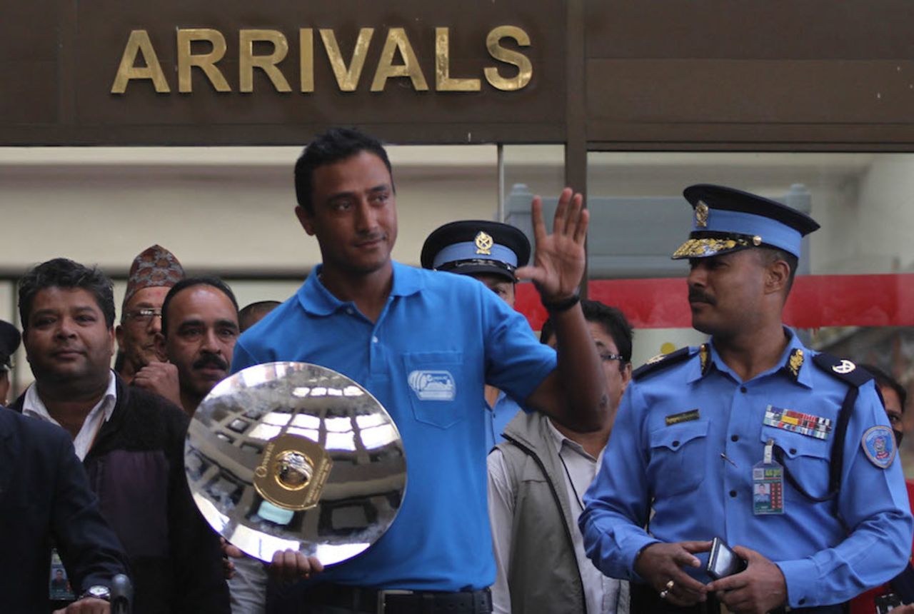 Paras Khadka arrives with the ICC WCL Division Three trophy, Kathmandu, October 31, 2014