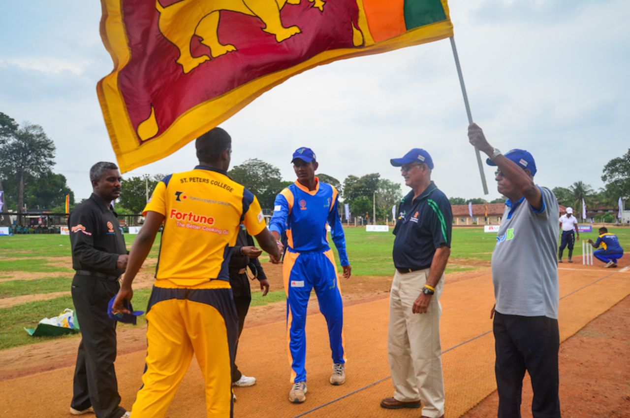 Michael Tissera (second from right) looks on during the toss, Oddusudan, October 31, 2014