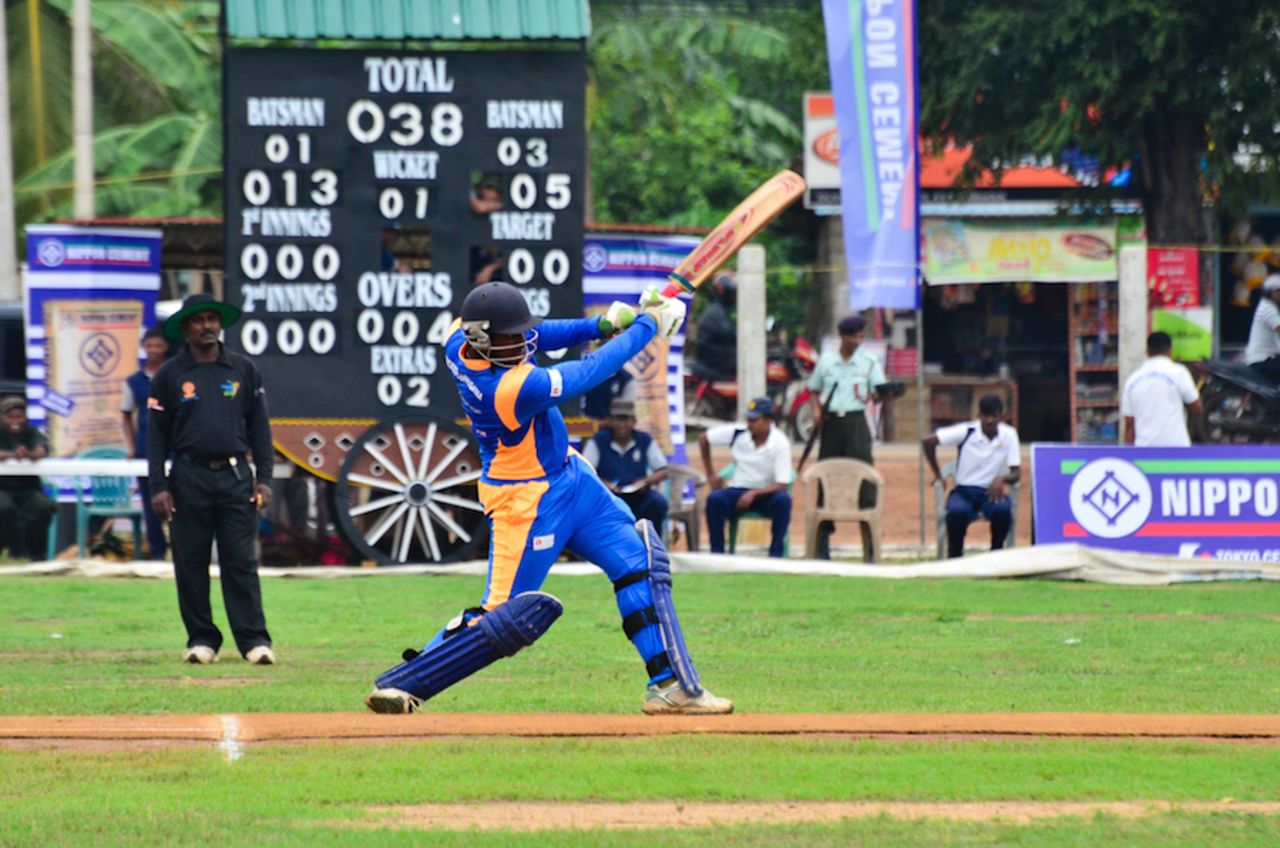A FOG-Seenigama batsman goes for a big swing, Kilinochchi, October 31, 2014