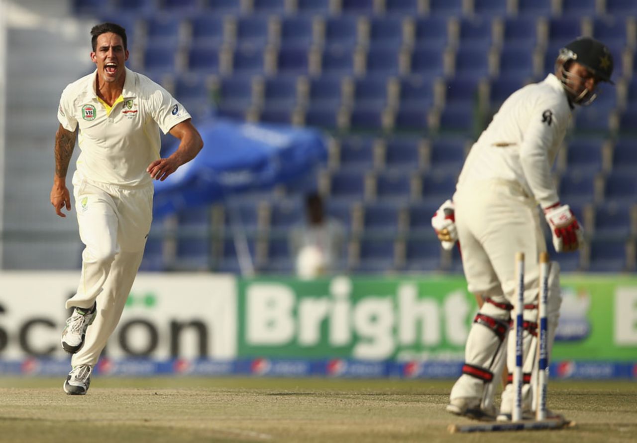 Mitchell Johnson exults after castling Ahmed Shehzad, Pakistan v Australia, 2nd Test, Abu Dhabi, 3rd day, November 1, 2014