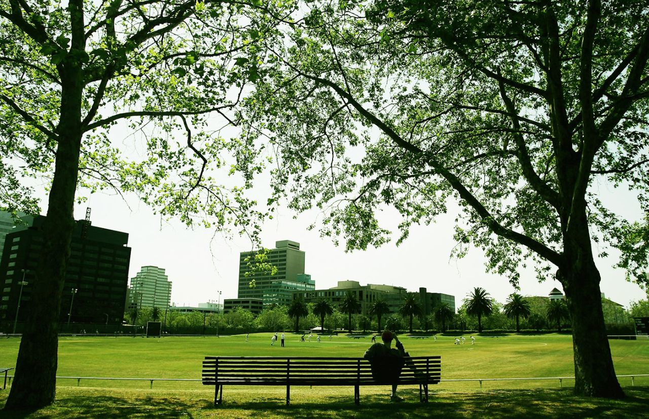 A spectator watches a club game on Albert Cricket Ground, Melbourne, October 7, 2006