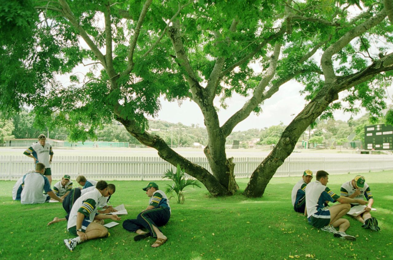 Australian players sit under the shade of a tree at the Allan Border Fields, Brisbane, January 8, 2000