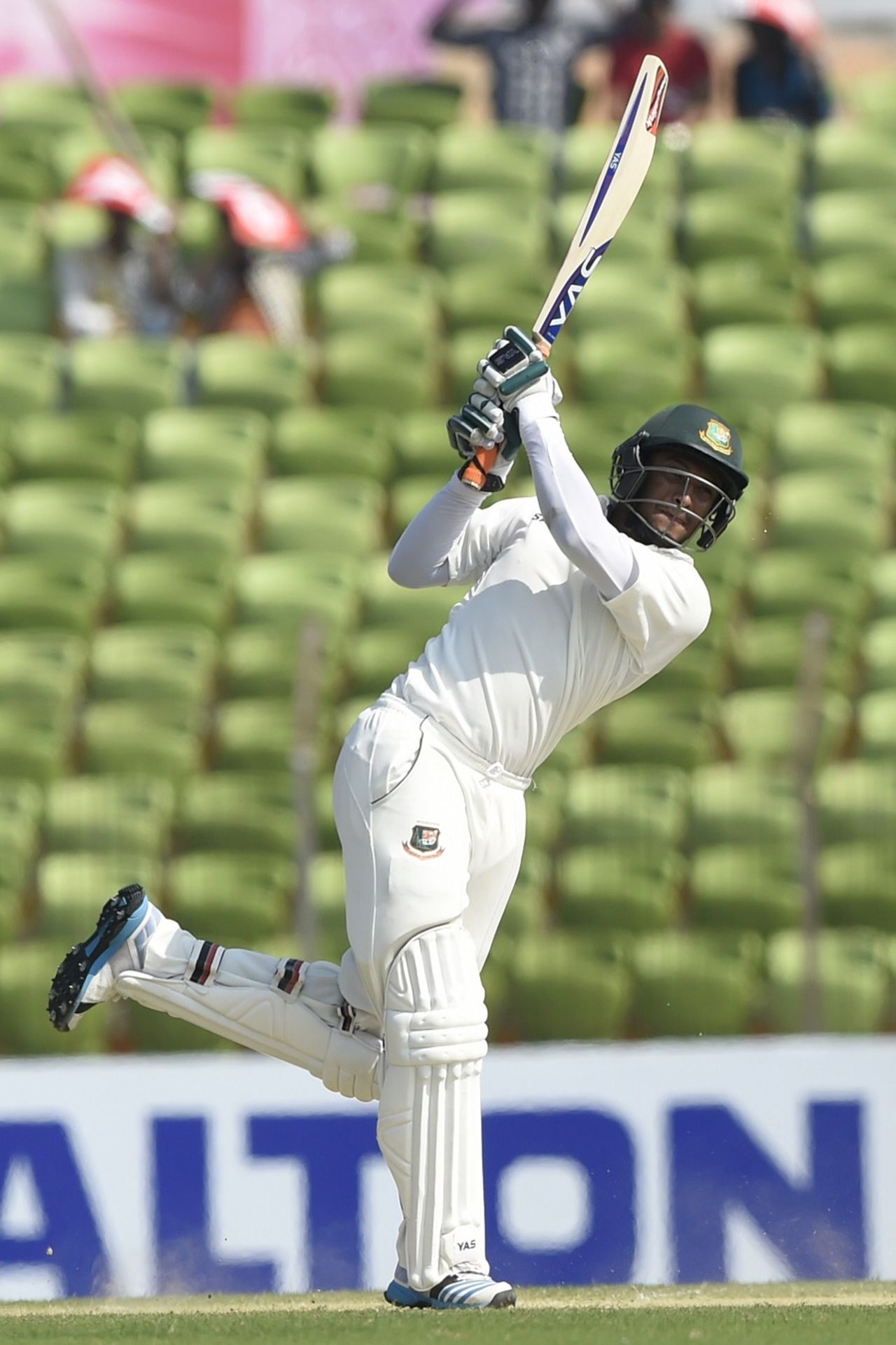Shakib Al Hasan launches the ball down the ground, Bangladesh v Zimbabwe, 2nd Test, Khulna, 2nd day, November 4, 2014