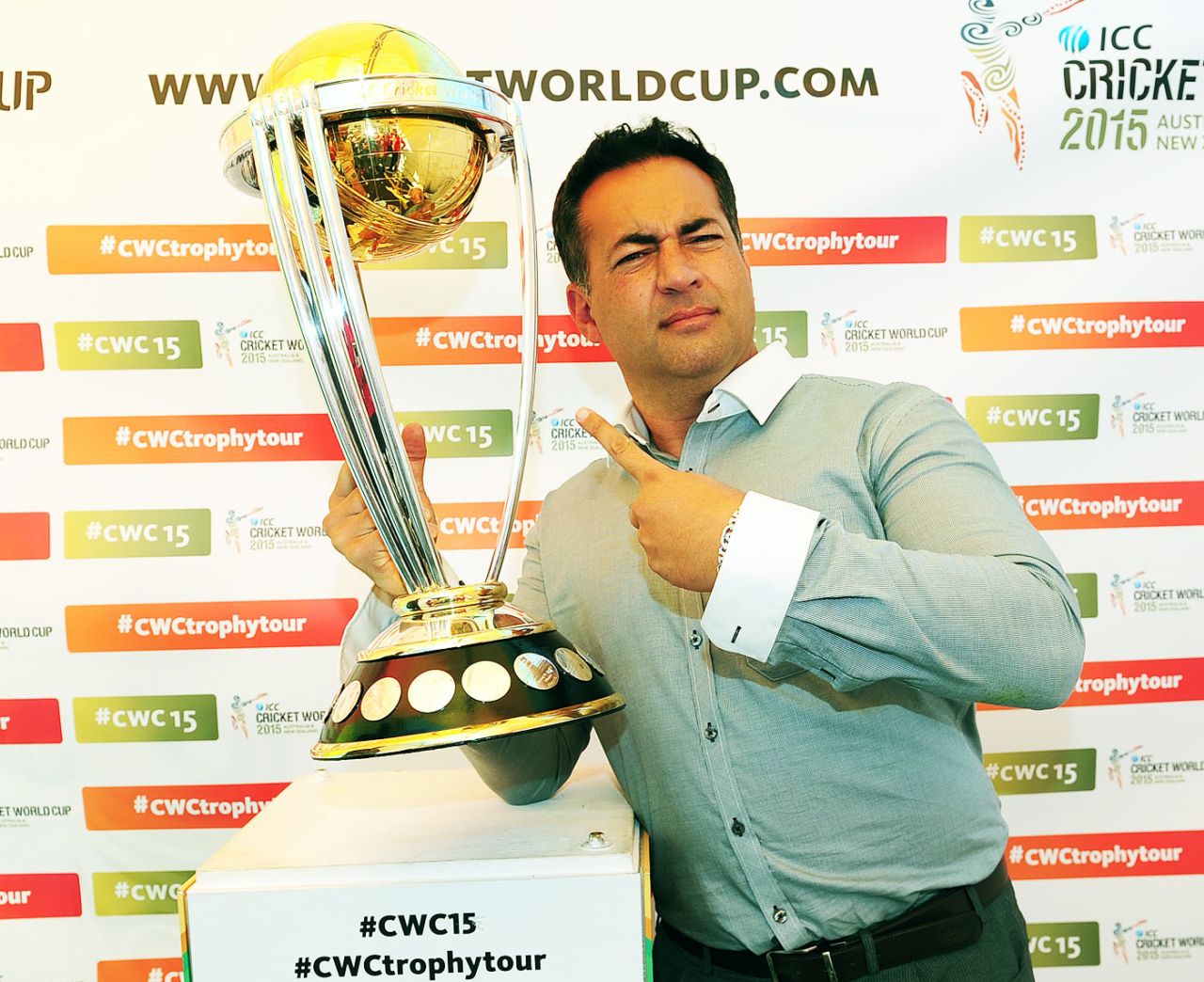 Former England captain Adam Hollioake poses with the World Cup trophy, Egbaston, August 23, 2014