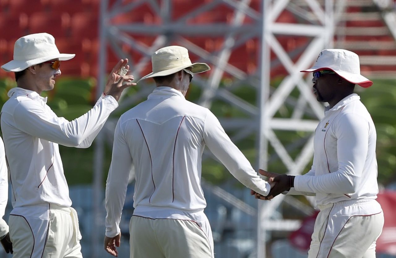 Hamilton Masakadza is congratulated after taking a catch, Bangladesh v Zimbabwe, 2nd Test, Khulna, 5th day, November 7, 2014