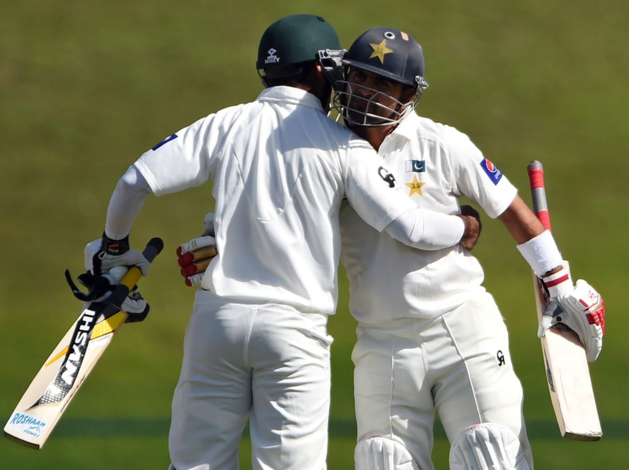 Ahmed Shehzad and Mohammad Hafeez congratulate each other, Pakistan v New Zealand, 1st Test, Abu Dhabi, 1st day, November 9, 2014
