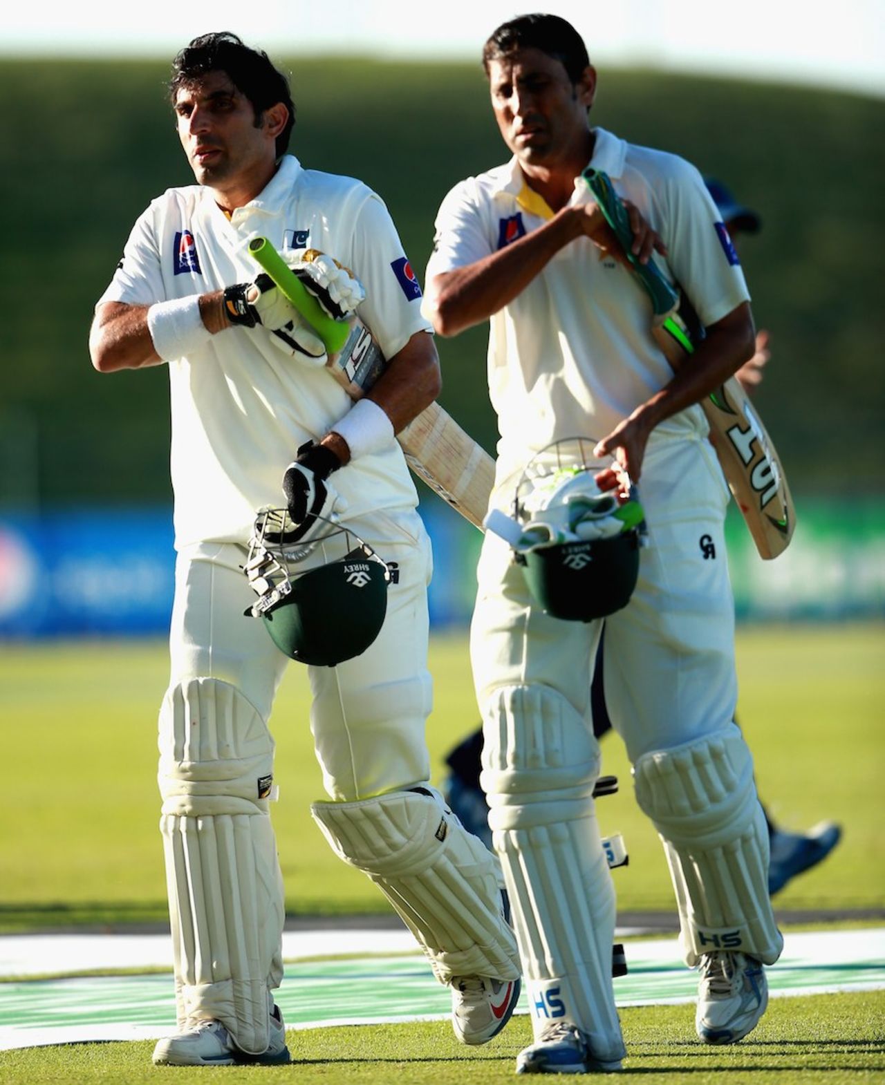 Misbah-ul-Haq lofts and Younis Khan walk off after the declaration, Pakistan v New Zealand, 1st Test, Abu Dhabi, 2nd day, November 10, 2014