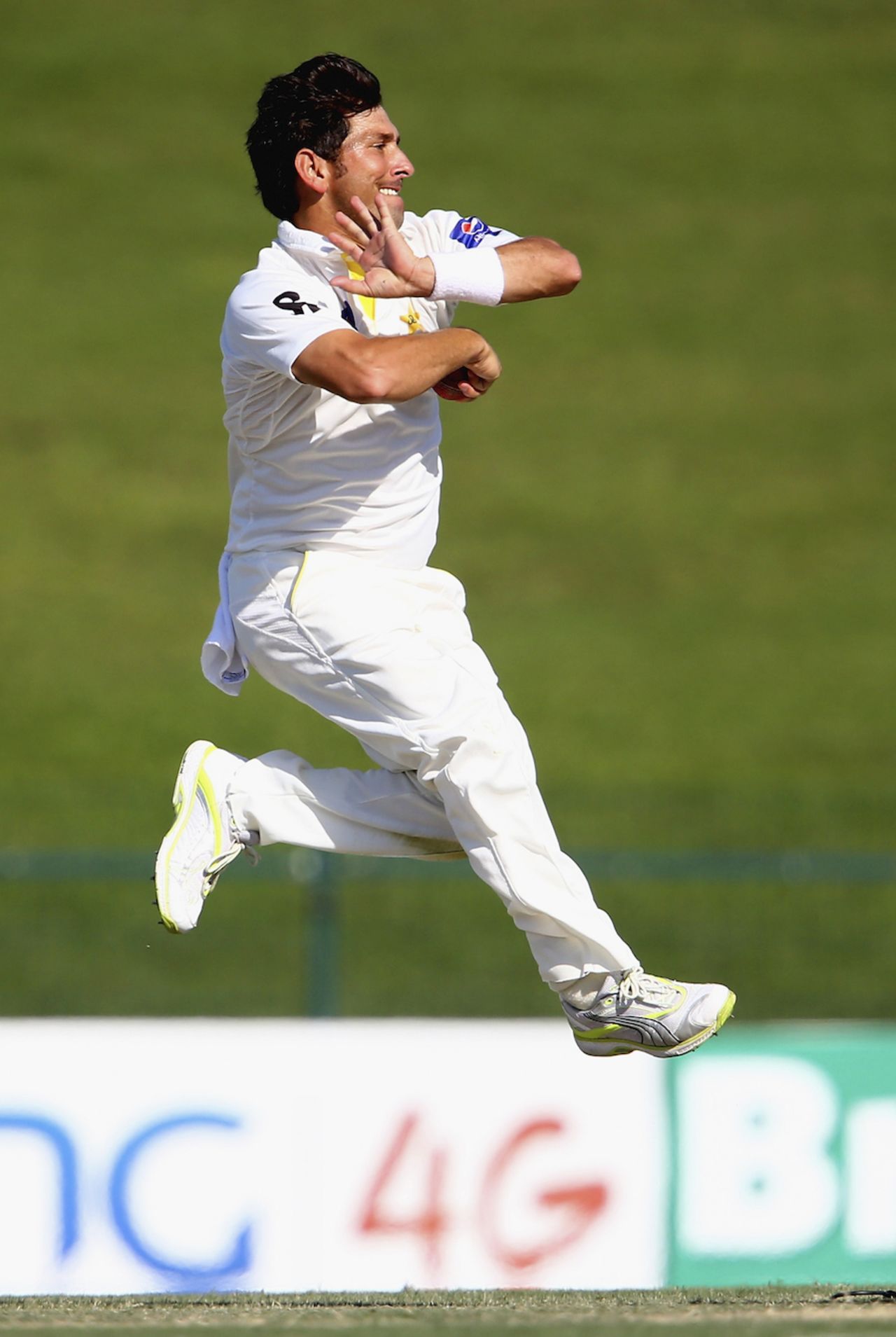 Yasir Shah leaps before delivering the ball, Pakistan v New Zealand, 1st Test, Abu Dhabi, 3rd day, November 11, 2014