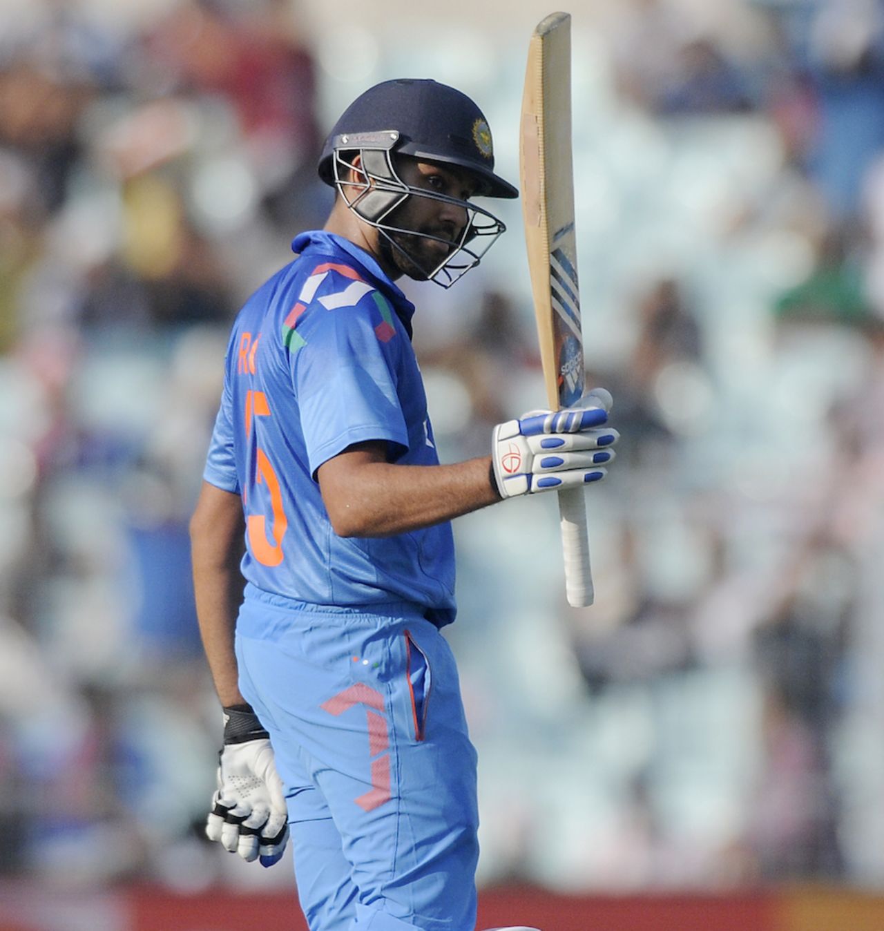 Rohit Sharma raises his bat on reaching his fifty, India v Sri Lanka, 4th ODI, Kolkata, November 13, 2014