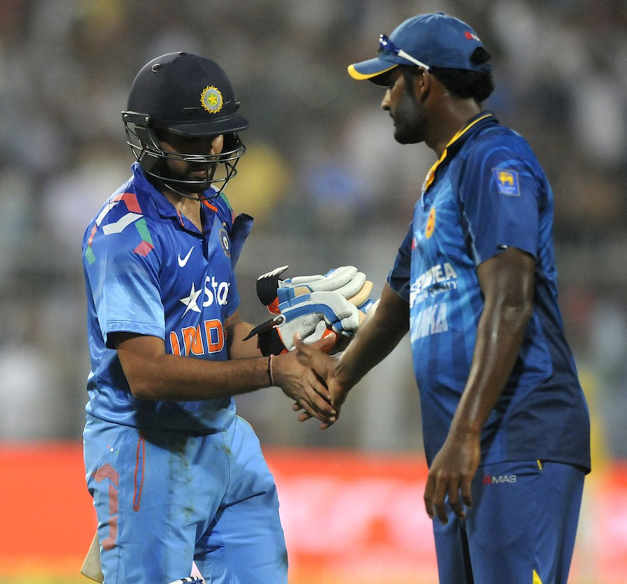 Thisara Perera congratulates Rohit Sharma. He dropped Rohit when he was on 4, India v Sri Lanka, 4th ODI, Kolkata, November 13, 2014