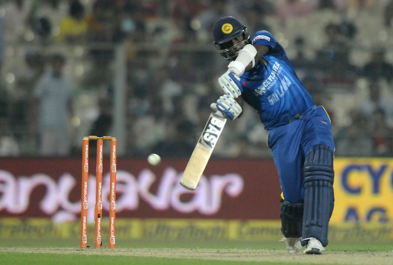 Angelo Mathews steps out for an extravagant drive, India v Sri Lanka, 4th ODI, Kolkata, November 13, 2014