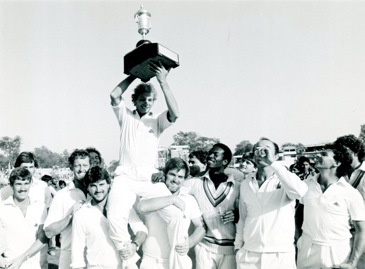 David Gower holds the trophy aloft after England's 2-1 series win in India, India v England, 5th Test, Kanpur, 5th day, February 5, 1985
