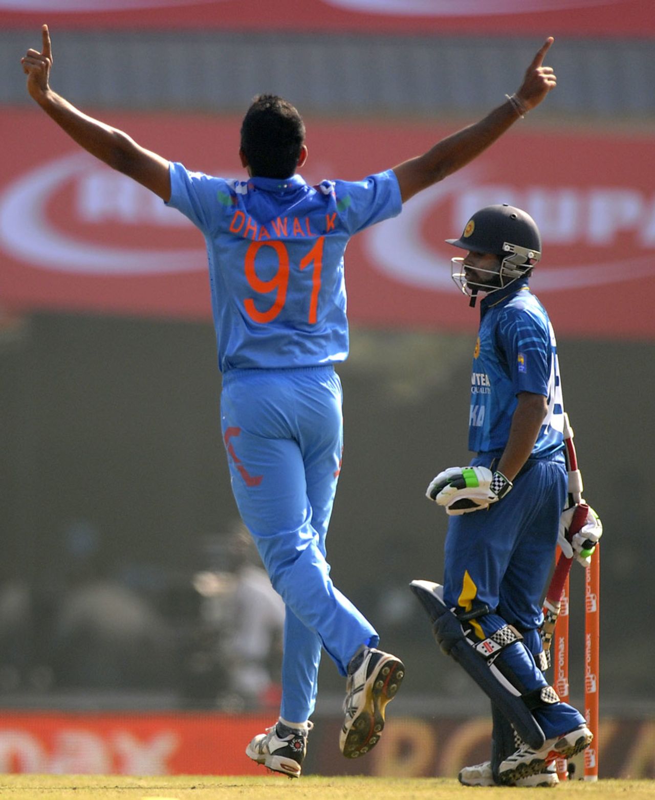Dhawal Kulkarni celebrates the wicket of Niroshan Dickwella, India v Sri Lanka, 5th ODI, Ranchi, November 16, 2014