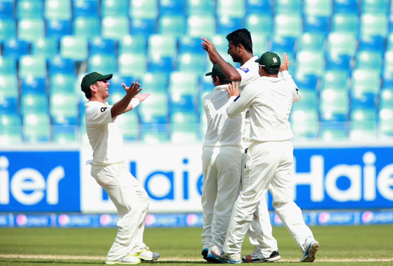 Ehsan Adil is congratulated on dismissing Brendon McCullum, Pakistan v New Zealand, 2nd Test, Dubai, 1st day, November 17, 2014