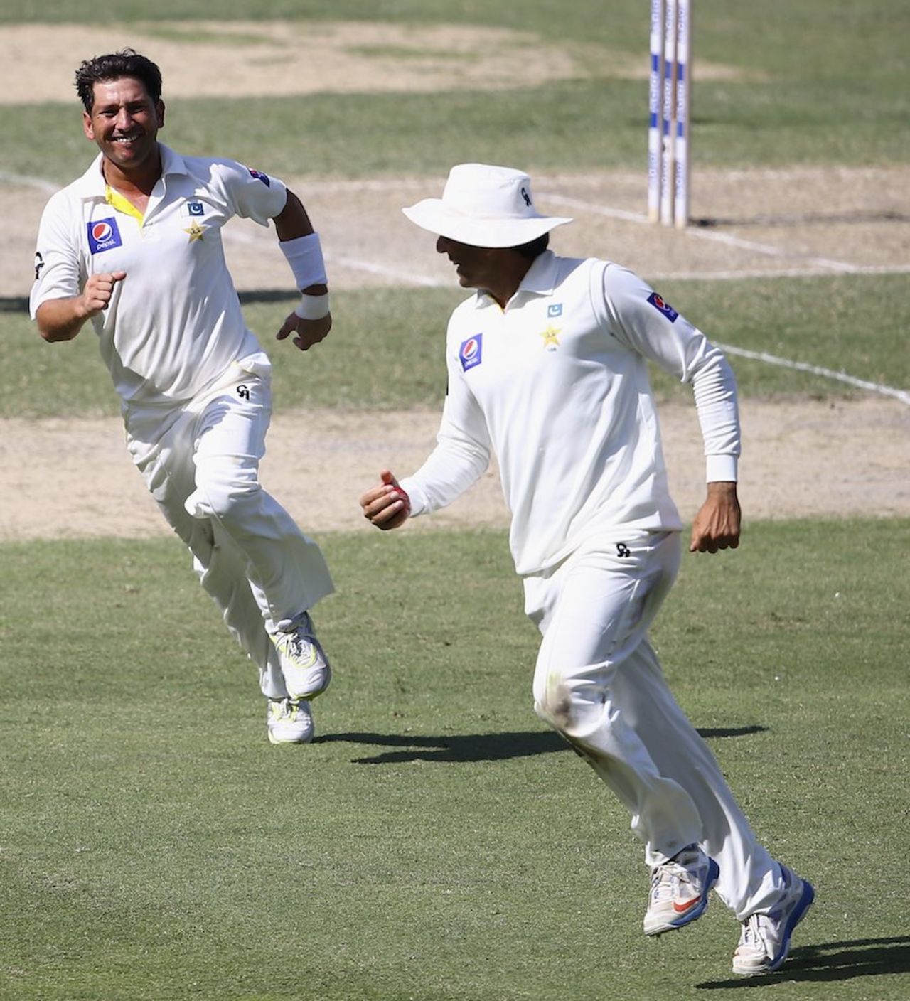 Yasir Shah and Misbah-ul-Haq celebrate a wicket, Pakistan v New Zealand, 2nd Test, Dubai, 2nd day, November 18, 2014