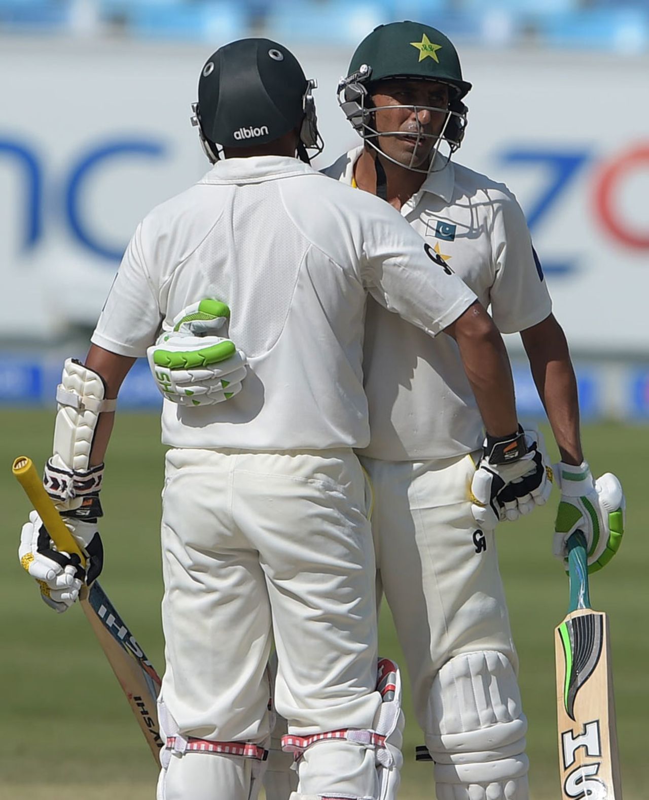 Younis Khan is congratulated by Azhar Ali after reaching his fifty, Pakistan v New Zealand, 2nd Test, Dubai, 3rd day, November 19, 2014