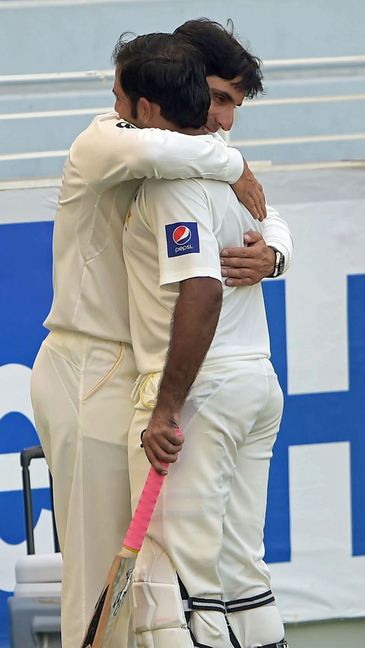 Misbah-ul-Haq embraces Sarfraz Ahmed after he was dismissed for 112, Pakistan v New Zealand, 2nd Test, Dubai, 4th day, November 20, 2014