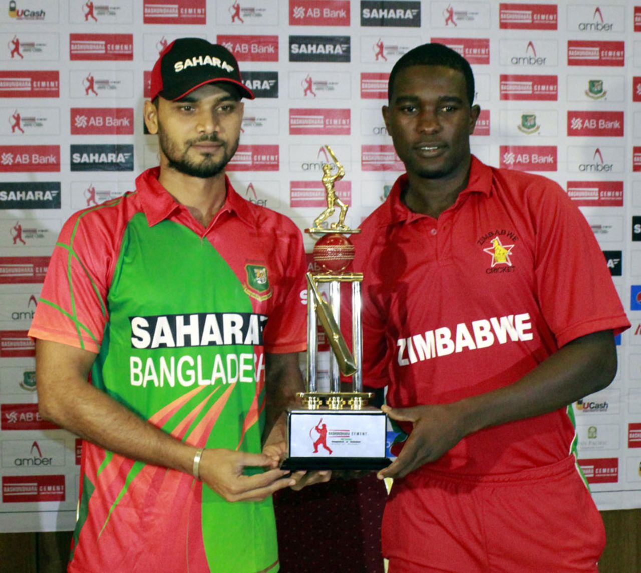 Mashrafe Mortaza and Elton Chigumbura pose with the ODI series trophy, Chittagong, November 20, 2014