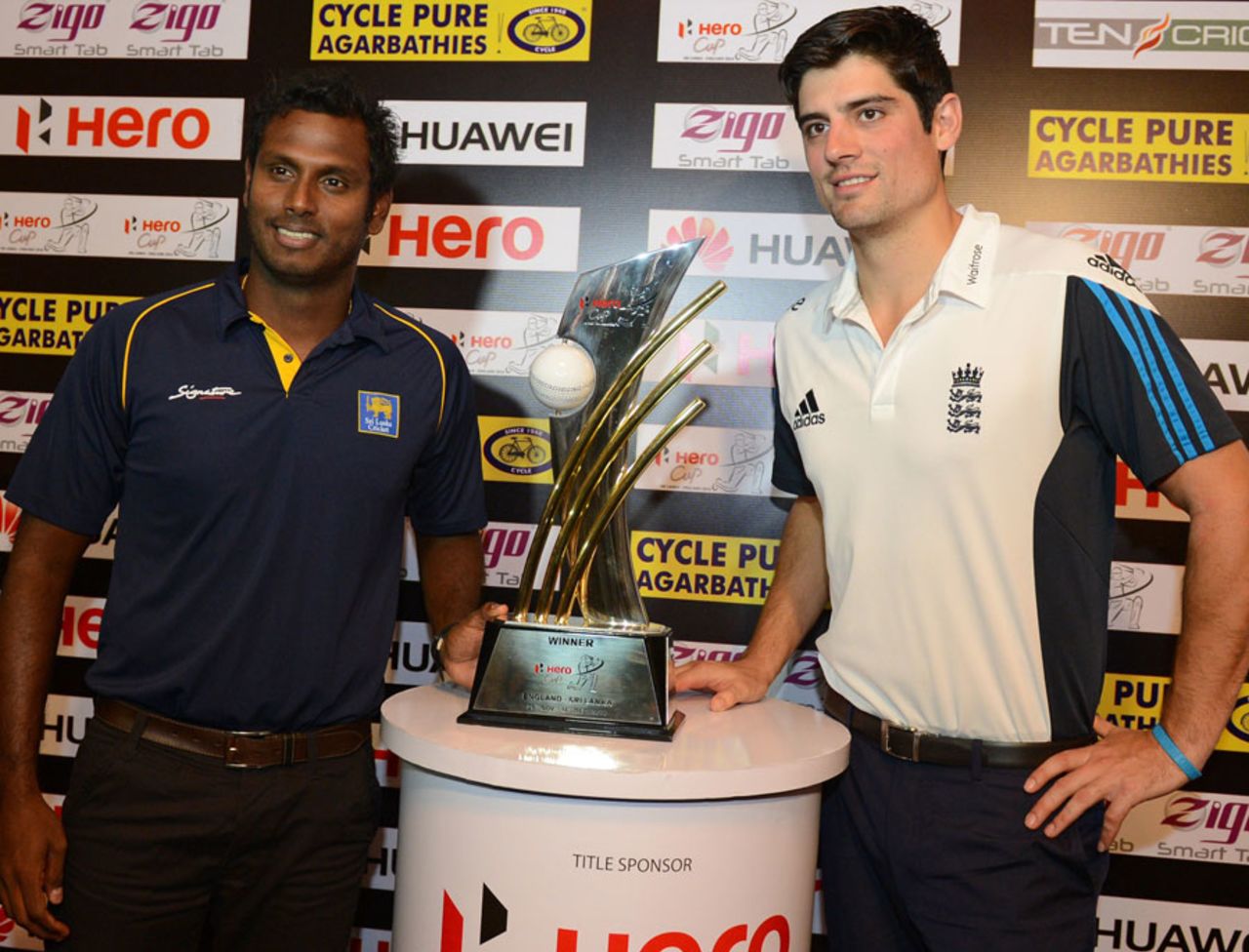 Angelo Mathews and Alastair Cook pose with the series trophy, Colombo, November 20, 2014