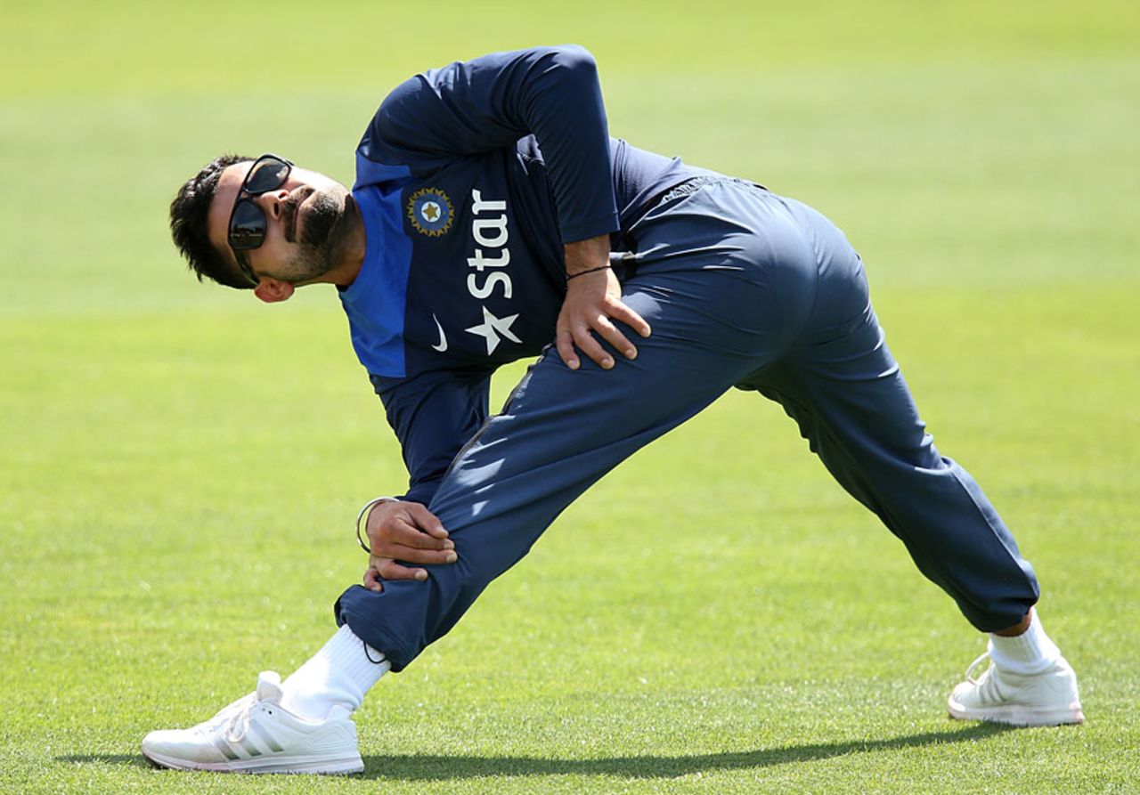 Virat Kohli stretches during India's training session, Gliderol Stadium, Adelaide, November 23, 2014